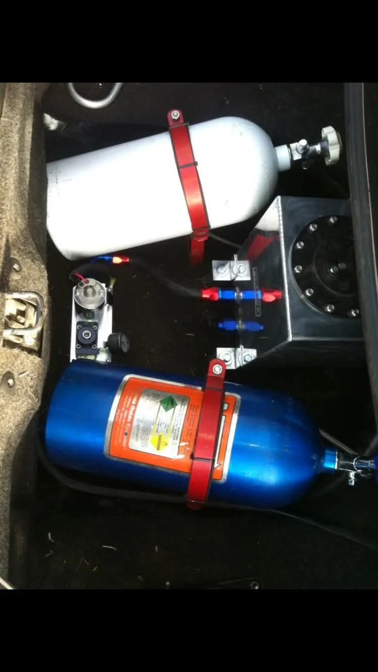 Performance system bottles mounted inside a vehicle